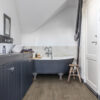 Quick-Step Majestic Woodland Oak Brown laminate flooring in a room setting