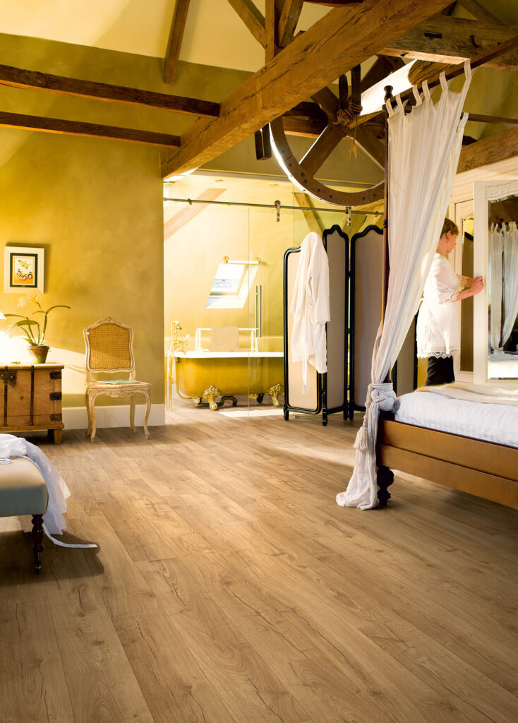 Quick-Step Impressive Classic Oak Natural 8mm laminate flooring in a room setting