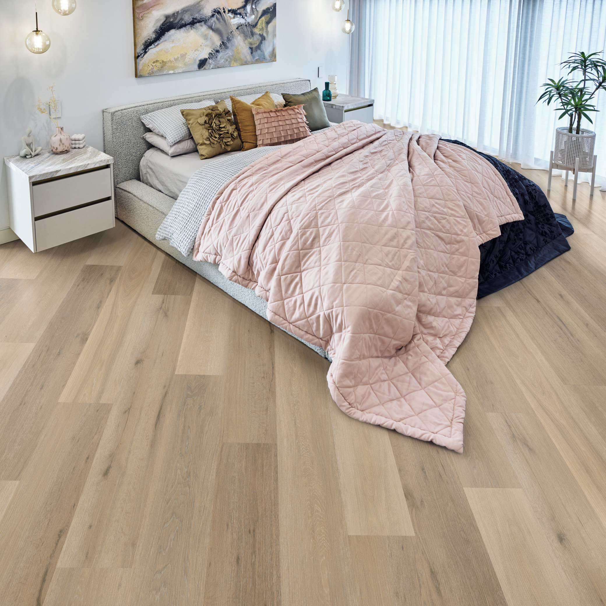 Bisque Ash hybrid flooring in a light, contemporary bedroom