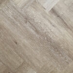 HTT Obsidian Herringbone Night Wind Hybrid Flooring