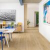 Quick-Step Impressive Ultra Cotton Oak laminate flooring in a room setting