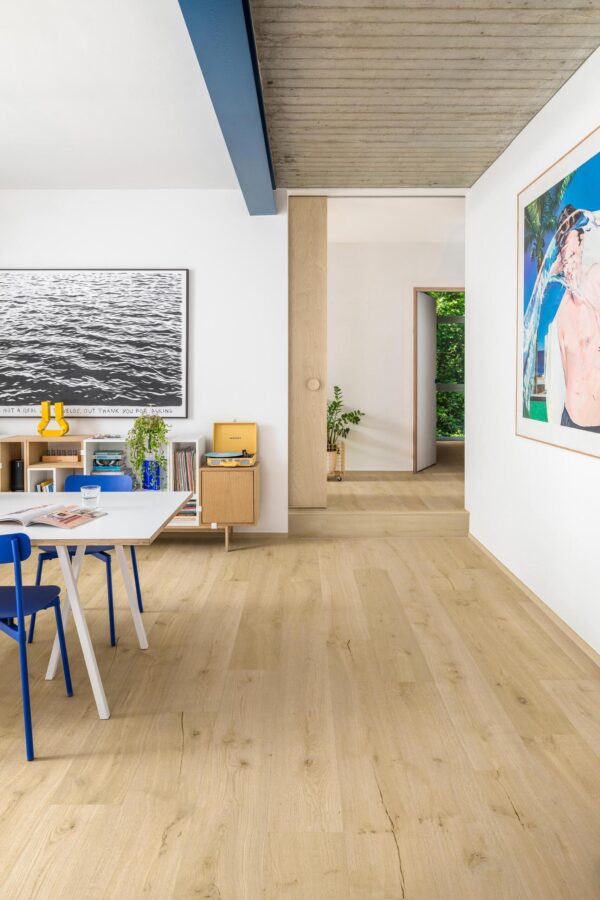 Quick-Step Impressive Ultra Cotton Oak laminate flooring in a room setting