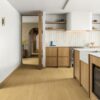 Quick-Step Impressive Ultra Dune Oak laminate flooring in a room setting