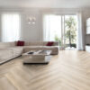 ArtiFloor Premium Herringbone Hamptons Haze vinyl flooring installed in a living room