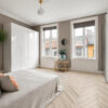 ArtiFloor Premium Herringbone Hamptons Haze vinyl flooring installed in a bedroom