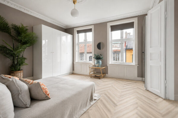 ArtiFloor Premium Herringbone Hamptons Haze vinyl flooring installed in a bedroom