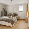 ArtiFloor Premium Herringbone Honeycomb Ash vinyl flooring installed in a bedroom