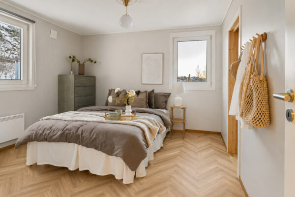 ArtiFloor Premium Herringbone Honeycomb Ash vinyl flooring installed in a bedroom