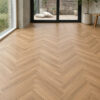 ArtiFloor Premium Herringbone Honeycomb Ash vinyl flooring installed in a sunlit living room
