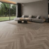 ArtiFloor Premium Herringbone Grey River Pine vinyl flooring installed in a living room