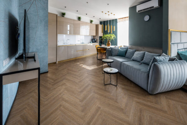 ArtiFloor Premium Herringbone Rustic Path vinyl flooring installed in an open-plan living room