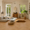 ArtiFloor Premium Herringbone Driftwood vinyl flooring installed in a light-filled living room