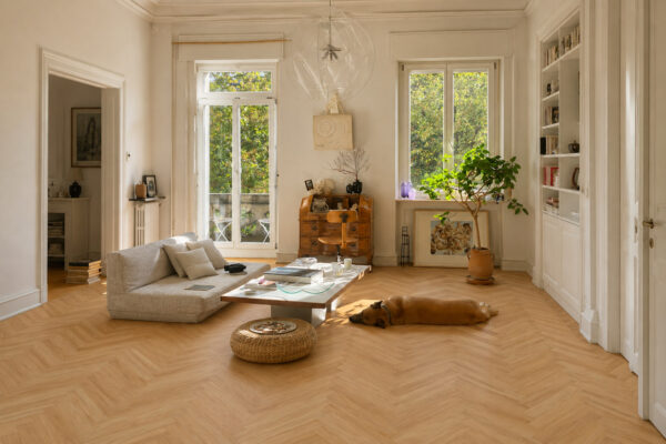 ArtiFloor Premium Herringbone Driftwood vinyl flooring installed in a light-filled living room