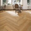 ArtiFloor Premium Herringbone Sierra Oak vinyl flooring installed in a dining room