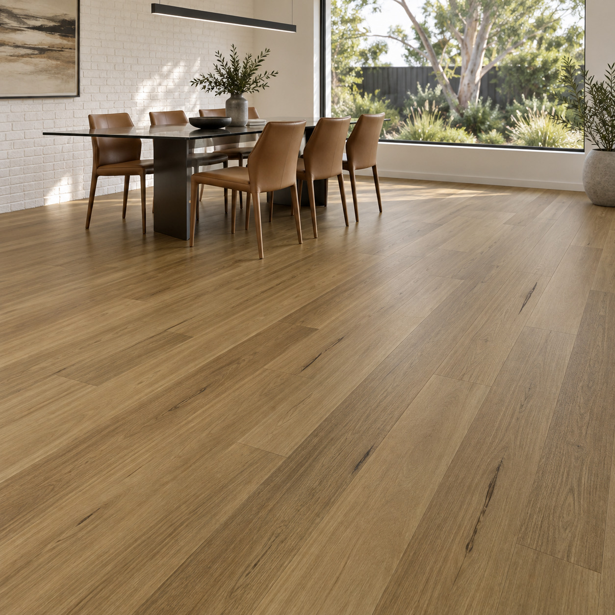 Godfrey Hirst Apollo Hardwood Blackbutt Classic Hybrid Flooring shown in a furnished home interior with flooring clearly visible.