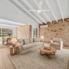 Styled living room with exposed brick wall and BestBuys Neutral Oak hybrid flooring