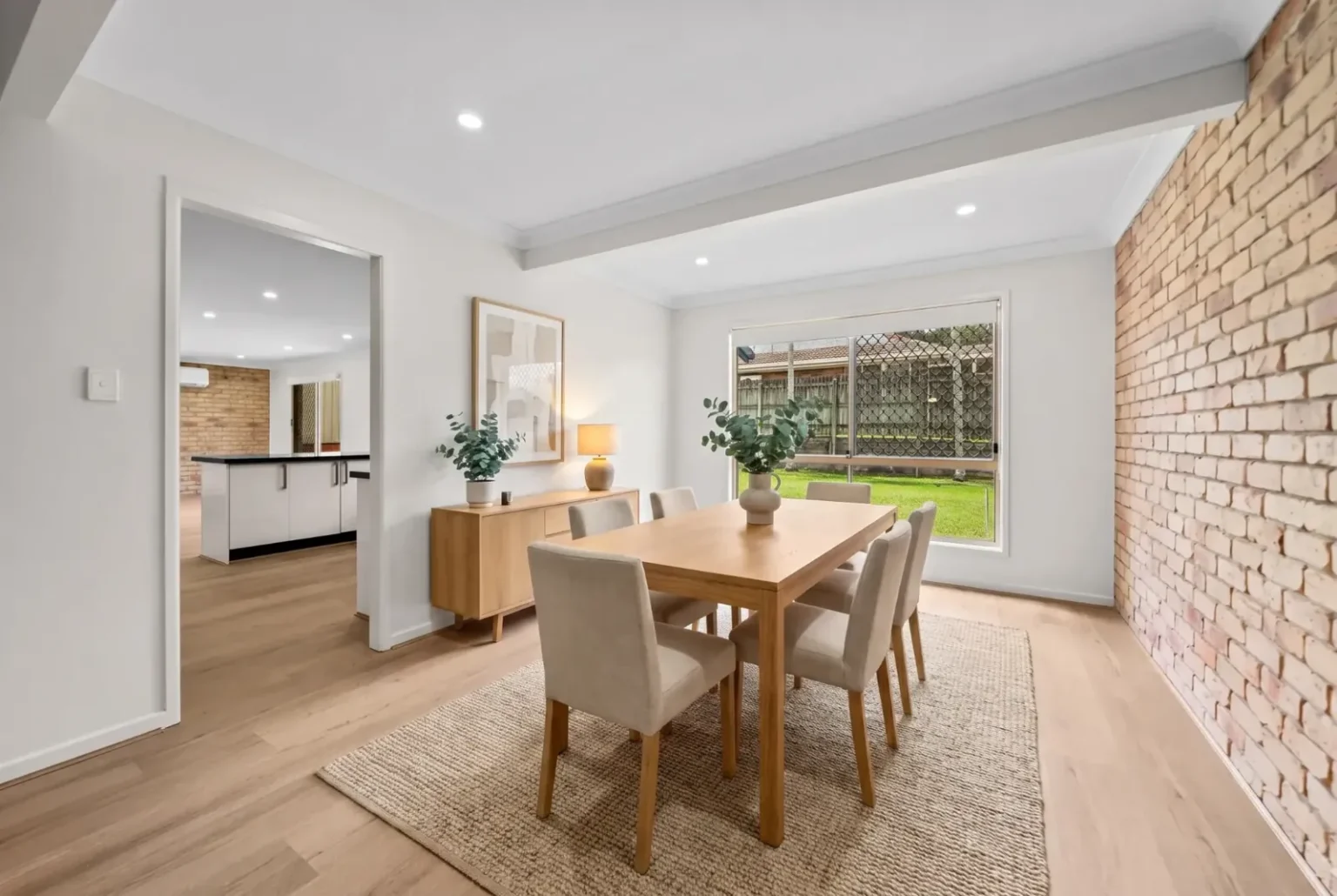 Dining room with timber table and BestBuys Neutral Oak hybrid flooring