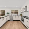 White U-shaped kitchen with BestBuys Neutral Oak hybrid flooring