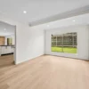 Unfurnished dining room showing BestBuys Neutral Oak hybrid flooring next to a brick wall